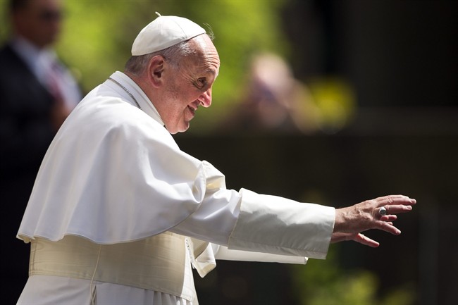 Pope Francis waves to school children as he walks towards them after arriving at the Apostolic Nunciature, the Vatican's diplomatic mission in Washington, Thursday, Sept. 24, 2015, after an address to a joint meeting of Congress. (AP Photo/Cliff Owen).