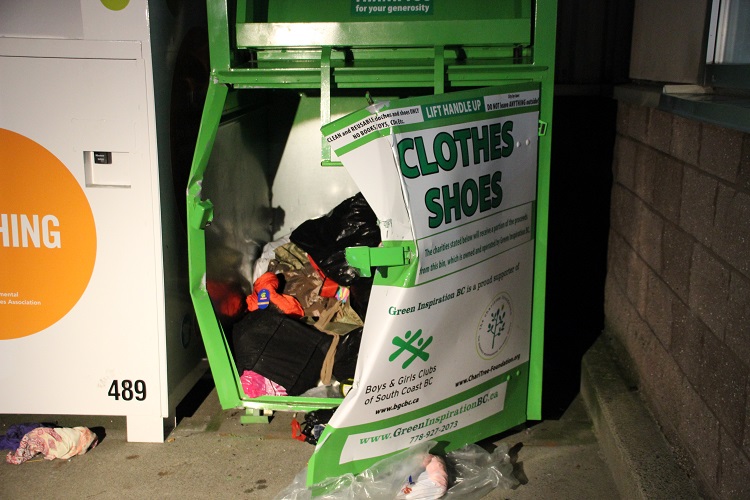 A 45-year-old homeless woman has died after being pulled from a clothing donation bin at a mall in Pitt Meadows.