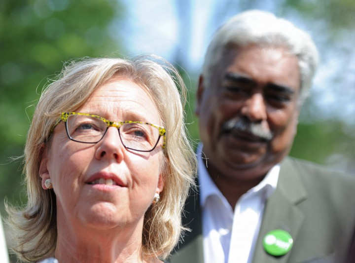 Green party leader Elizabeth May speaks to the media as candidate Jos Nunez-Melo looks on during a federal election campaign stop in Montreal, Sunday, August 16, 2015.