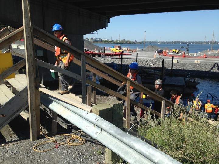 Construction workers say they don't have to wear safety harnesses on the bridge, Tuesday, September 15, 2015.