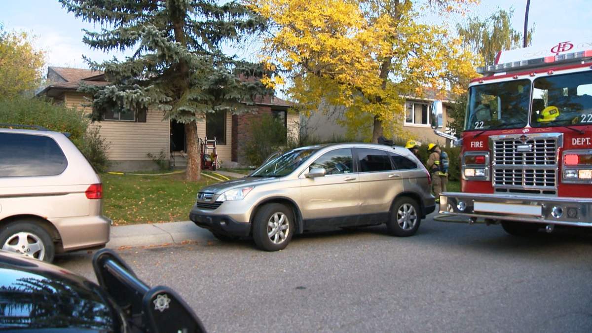 Firefighters respond to a house fire in the 200 block of Rundleview Drive N.E. at around 8:40 a.m. on Tuesday, September 22, 2015. 