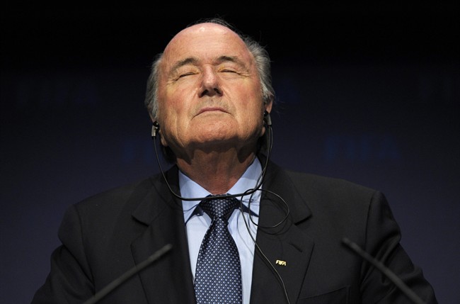 FILE - In this Nov. 19, 2010 file photo FIFA President Sepp Blatter pauses during a press conference following a meeting of the Executive Committee in Zurich, Switzerland. On Friday, Sept. 25, 2015 Swiss attorney general opened criminal proceedings against FIFA President Sepp Blatter. (Steffen Schmidt/Keystone via AP).