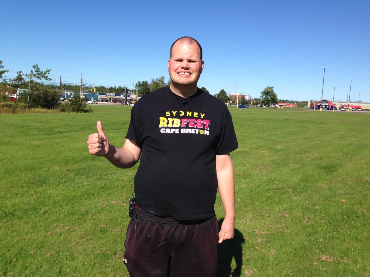 Frankie MacDonald recording one of his characteristically energetic weather reports.