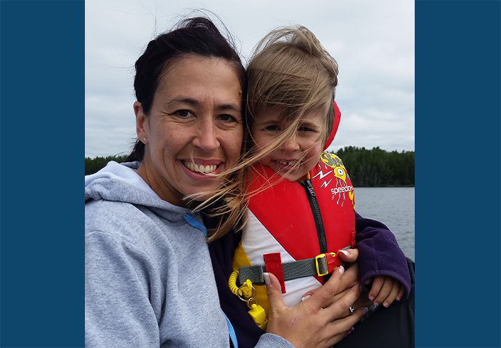 Jill Officer with her daughter Camryn out on the boat while on a back country camping trip.