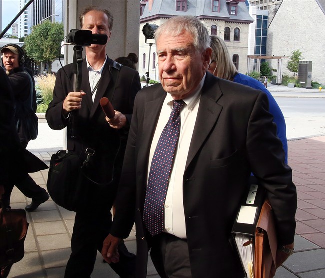Bruce Carson, a former Stephen Harper adviser, makes his way to the Ottawa court house to face an influence-peddling charge handed down in 2012 and linked to the proposed sale of water-filtration systems to native reserves, in Ottawa, Monday September 14, 2015. 