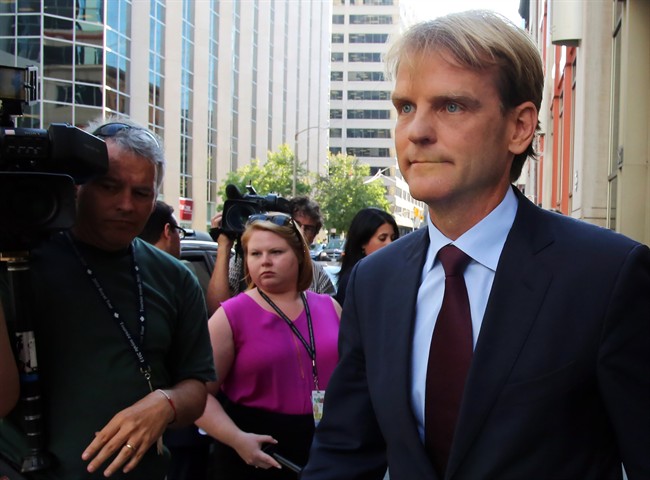 Former immigration minister Chris Alexander talks to reporters after a television interview in Ottawa on Thursday, September 3, 2015.