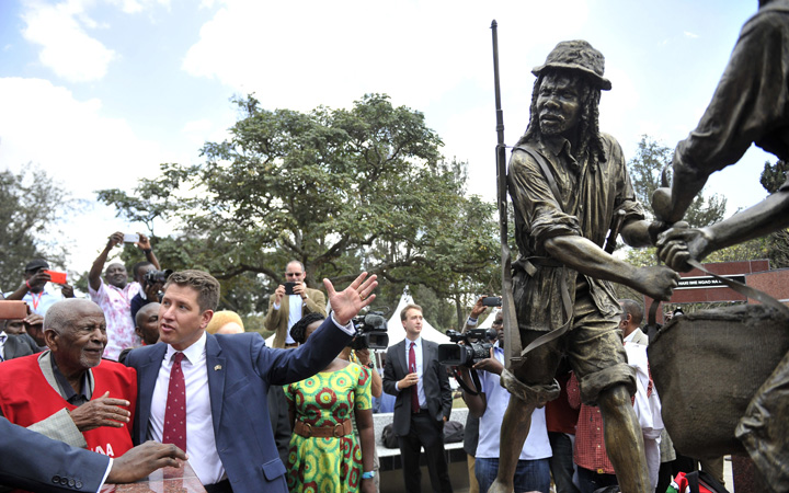 Secretary General of the Mau Mau War Veterans Association Gitu Wa Kahengeri (L) and British High Commissioner to Kenya Christian Turner attend the unveiling of the memorial dedicated to the thousands killed, tortured and jailed in the Mau Mau rebellion on September 12, 2015 in Nairobi. 