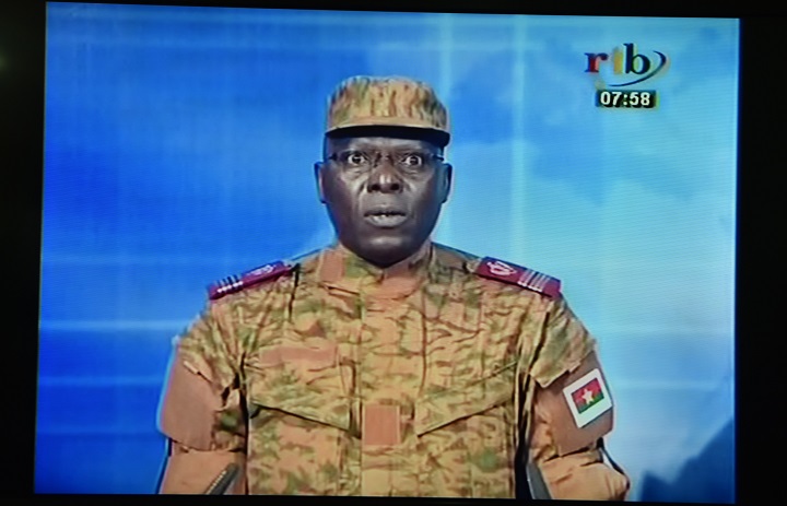 A picture taken on September 17, 2015 shows a TV screen during the broadcast of the speech of Lieutenant-colonel  Mamadou Bamba announcing that a new "National Democratic Council" had put an end "to the deviant regime of transition" in the west African state and Burkina's interim president had been stripped of his powers. Burkina Faso's presidential guard on September 16, 2015 detained the interim president and prime minister, plunging the west African country into uncertainty just weeks before the first elections since the ouster of ex-leader Blaise Compaore.  