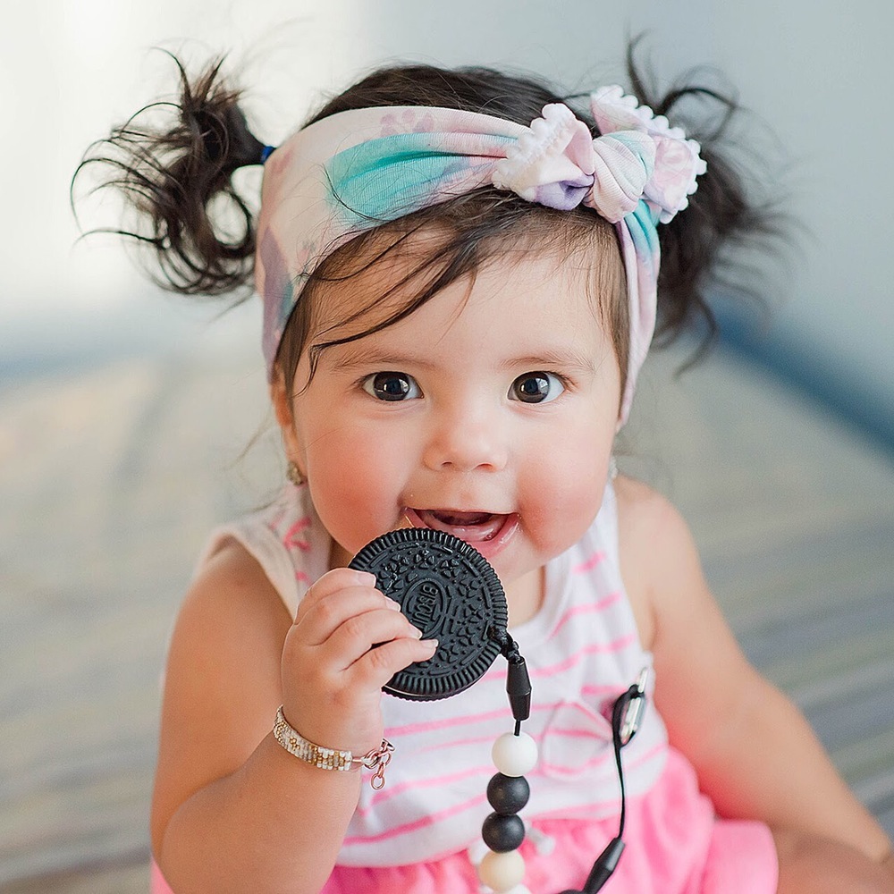 Annabelle with the cookie teether. Credit: Glitter & Spice.