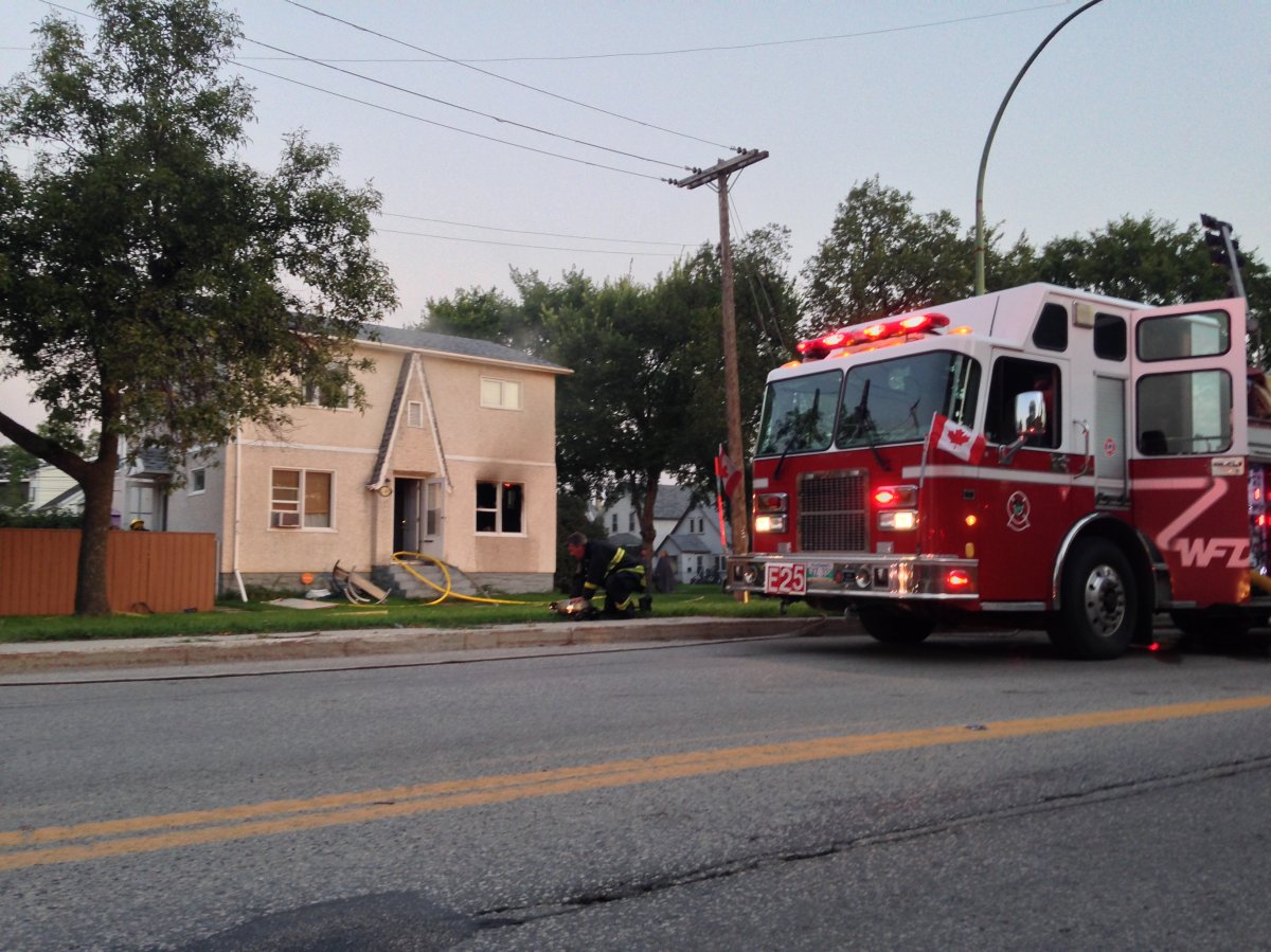 Fire crews battle fire in Transcona Tuesday morning.