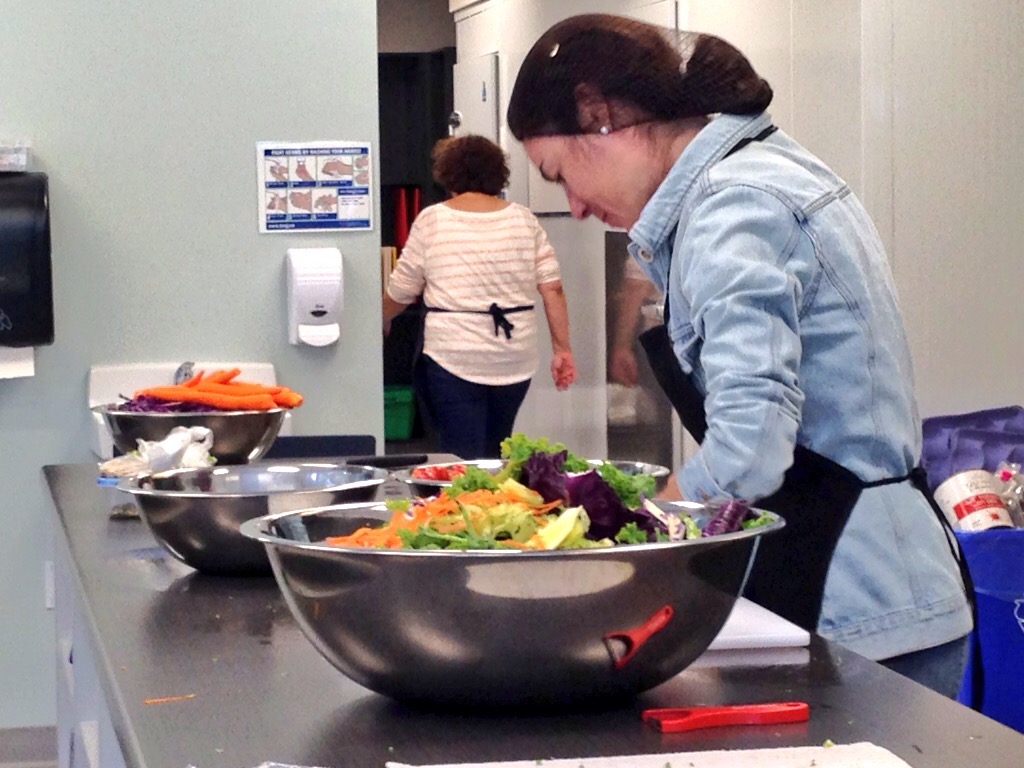 Volunteers get to work making meals at the Dartmouth North Community Food Centre.
