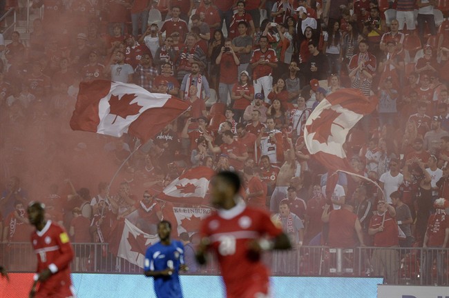 Canada fans cheer in the stands during first half FIFA World Cup qualifying soccer action against Belize in Toronto Friday September 4, 2015. The Canadian men, ranked No. 102 in the world, look to finish off the job Tuesday when they face No. 128 Belize at FFB Field in the capital of Belmopan.