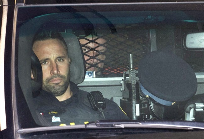 Basil Borutski leaves in a police vehicle after appearing at the courthouse in Pembroke, Ont. on Wednesday, Sept. 23, 2015. Borutski has been charged with three counts of first-degree murder in the separate slayings of three women whose deaths sparked a lockdown and manhunt in an ordinarily peaceful area of eastern Ontario on Tuesday.