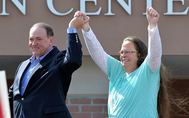 In this Tuesday, Sept. 8, 2015, file photo, Rowan County Clerk Kim Davis, with Republican presidential candidate Mike Huckabee at her side, greets the crowd after being released from the Carter County Detention Center, in Grayson, Ky.