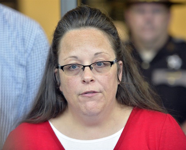 Rowan County Clerk Kim Davis makes a statement to the media at the front door of the Rowan County Judicial Center in Morehead, Ky., Monday, Sept. 14, 2015.