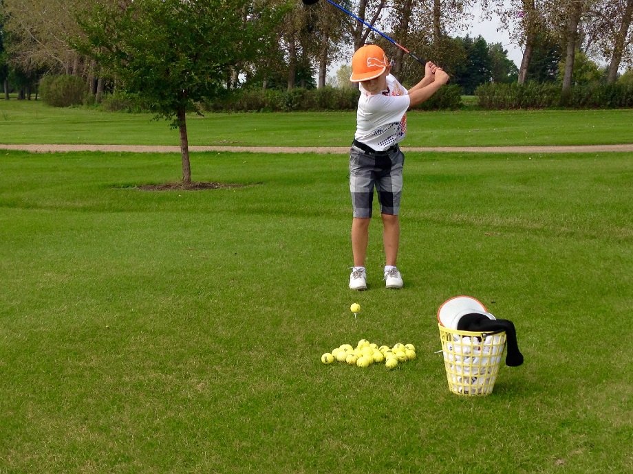 Ty Brewster is a six-year-old golfer who can easily clear a green from 150 yards out.