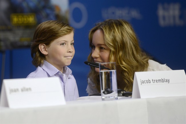 Actors Jacob Tremblay, left, and Brie Larson attend the press conference for "Room" at the 2015 Toronto International Film Festival in Toronto, Monday, Sept, 14, 2015.