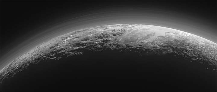 Just 15 minutes after its closest approach to Pluto on July 14, 2015, NASA’s New Horizons spacecraft looked back toward the sun and captured this near-sunset view of the rugged, icy mountains and flat ice plains extending to Pluto’s horizon. 
