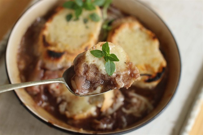 This Sept. 14, 2015 photo shows grilled French onion soup in Concord, N.H. This dish is from a recipe by Elizabeth Karmel.