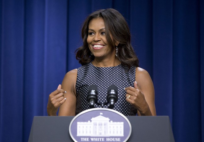 File-This photo taken Sept. 16, 2015, shows First lady Michelle Obama speaking in the South Court Auditorium of Eisenhower Executive Office Building on the White House complex in Washington. The first lady is paying a visit to the children’s animated series “Doc McStuffins.” In the episode, the cartoon Mrs. Obama invites Doc and other kids who are making a difference in their communities to the White House to be honored. Doc receives special recognition when the first lady appoints her the official toy doctor for the White House. The episode featuring Mrs. Obama airs Monday, Oct. 5, which is Child Health Day in the United States. (AP Photo/Carolyn Kaster, File).
