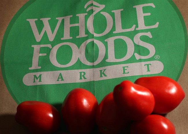In this Monday, July 29, 2013, file photo, produce is placed on a Whole Foods paper bag in Andover, Mass.