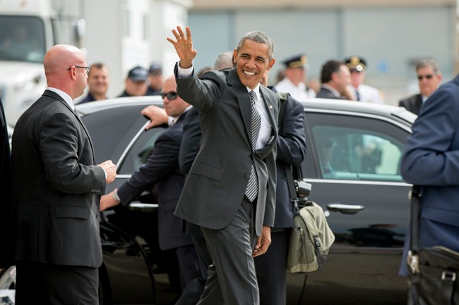 President Barack Obama waves to guests at JFK International Airport, N.Y., Sunday, Sept. 27, 2015, before Boarding Marine One for a short trip to the Wall Street Helicopter Pad in Manhattan.