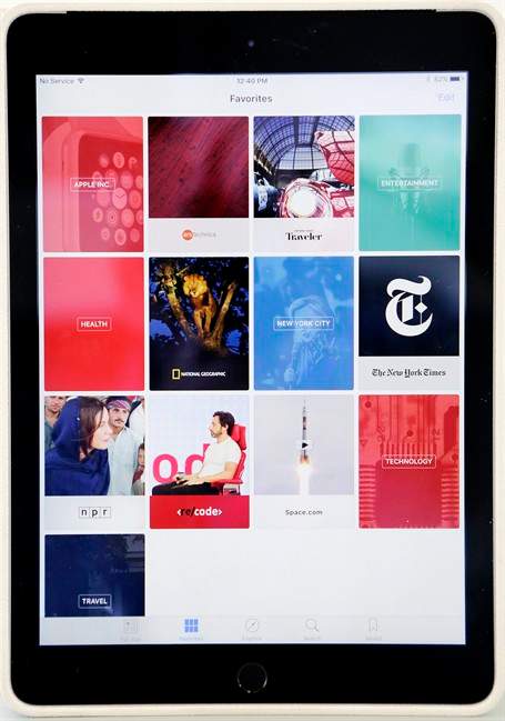 The "favorites" section of Apple's new News app is displayed on an iPad, Wednesday, Sept. 2, 2015 in New York. The tech giant will launch a news service for iPhones and iPads this month featuring partnerships with more than 50 companies so far, including CNN and National Geographic. That means millions of devices will get the app on the home screen, with no separate download required.