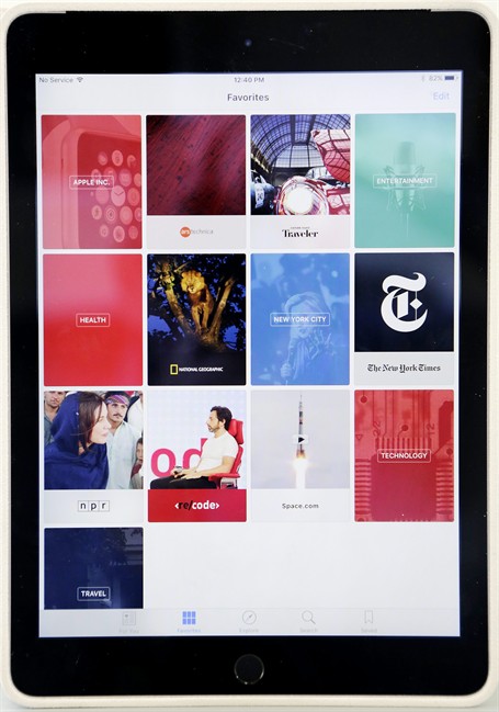 The "favorites" section of Apple's new News app is displayed on an iPad, Wednesday, Sept. 2, 2015 in New York. The tech giant will launch a news service for iPhones and iPads this month featuring partnerships with more than 50 companies so far, including CNN and National Geographic. That means millions of devices will get the app on the home screen, with no separate download required.