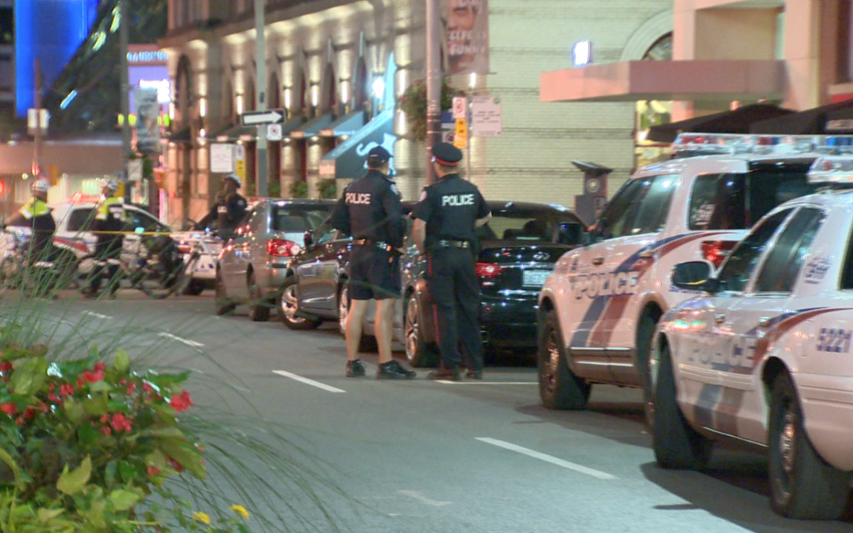 Police investigate a double shooting inside Michael's on Simcoe on Sept. 20, 2015.