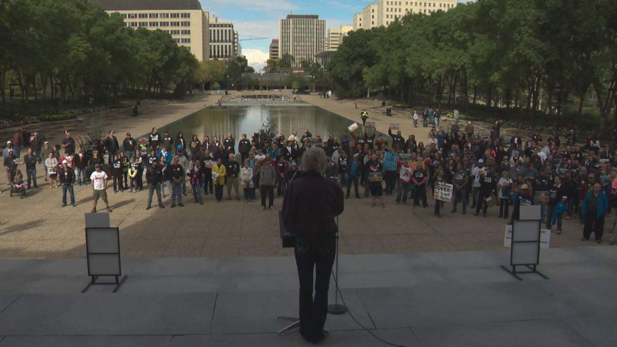 About 200 people critical of Alberta's NDP government gathered at the Legislature Sunday afternoon to demand a provincial budget within 30 days.
