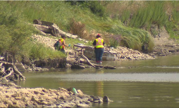 Volunteers search the banks of the Red River for evidence that could bring missing men or women home.