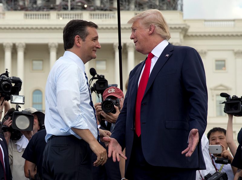 Republican presidential candidate Donald Trump and Republican presidential candidate Sen. Ted Cruz, R-Texas, greet each other on stage during a rally organized by Tea Party Patriots in on Capitol Hill in Washington, Wednesday, Sept. 9.