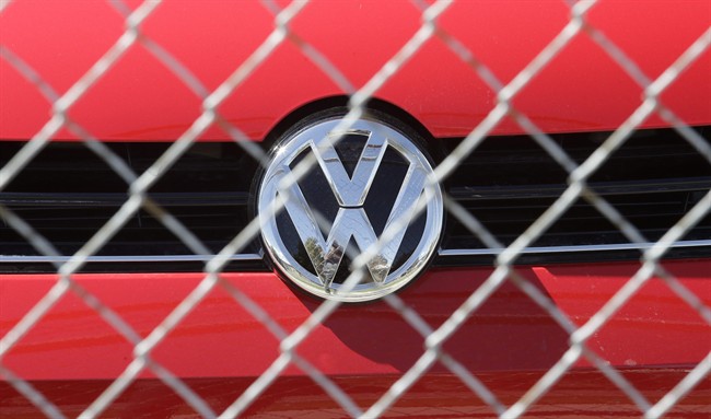 A Volkswagen diesel sits behind a security fence on a storage lot near a VW dealership in Salt Lake City. Volkswagen CEO Martin Winterkorn resigned Wednesday, days after admitting that the world's top-selling carmaker had rigged diesel emissions to pass U.S. tests during his tenure. (AP Photo/Rick Bowmer)