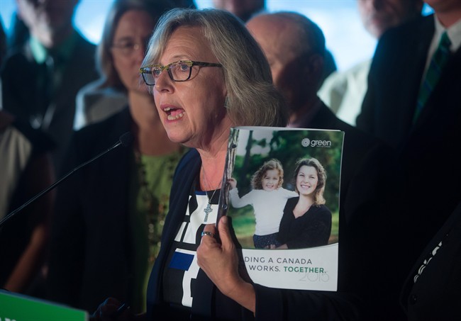 Green Party Leader Elizabeth May holds a copy of her party's platform during a campaign event in Vancouver, B.C., on Wednesday September 9, 2015. A federal election will be held October 19.