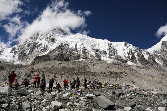 In this Sept. 27, 2015 file photo, trekkers rest at Everest Base Camp, Nepal. 
