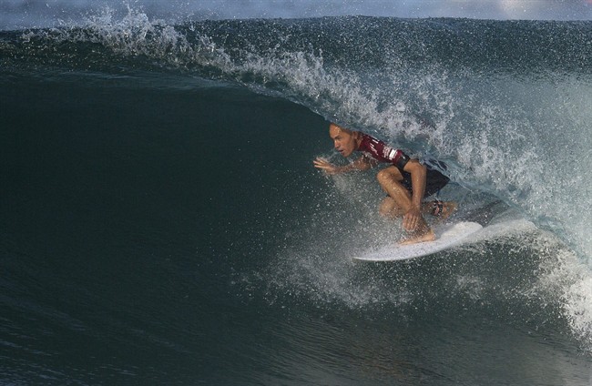 In this May 12, 2015 file photo, U.S. surfer Kelly Slater competes in the 2015 Oi Rio Pro World Surf League competition at Barra da Tijuca beach in Rio de Janeiro, Brazil.