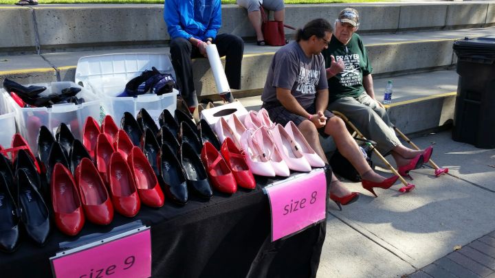 Men strap on their heels in support of ending domestic violence.