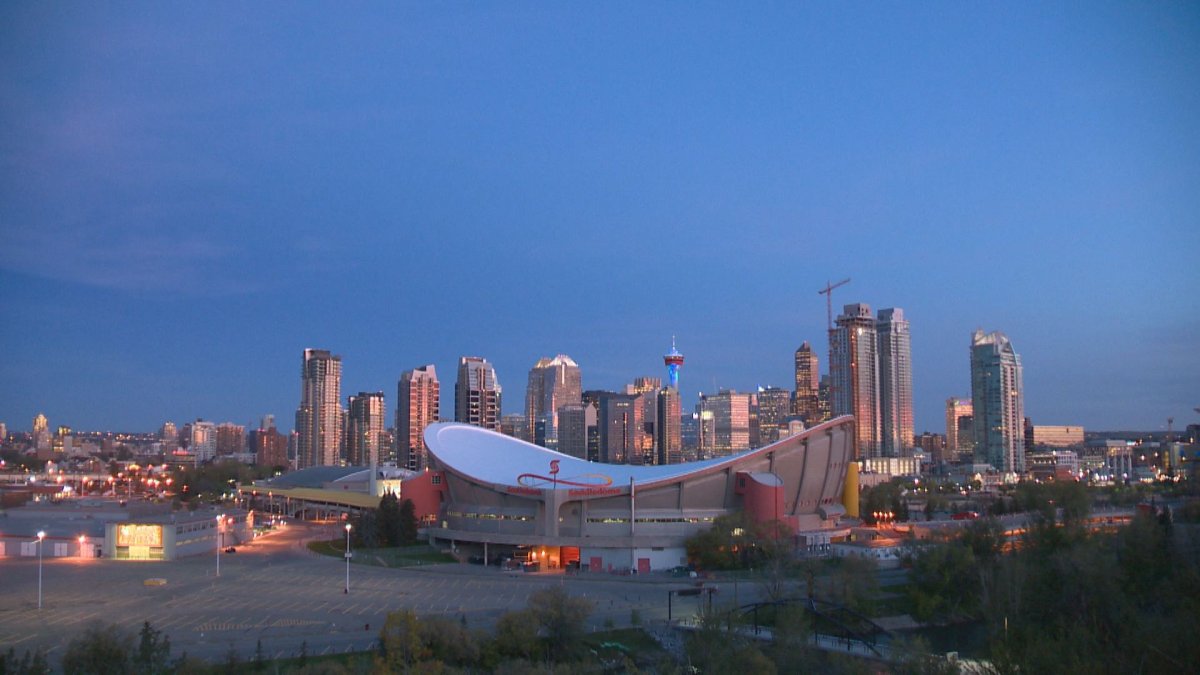 A view of Downtown Calgary, featuring the Saddledome and Calgary Tower.