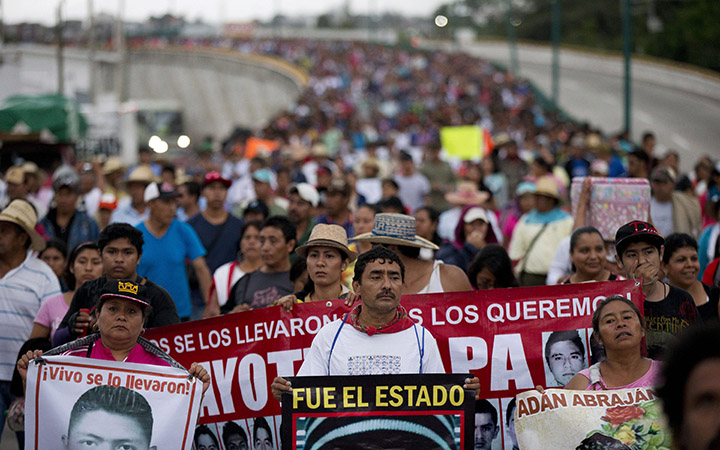 Relatives of the 43 missing Ayotzinapa teachers' college students lead a march marking the one-year anniversary of the students' disappearances in Chilpancingo, Mexico on Sept. 26, 2015.