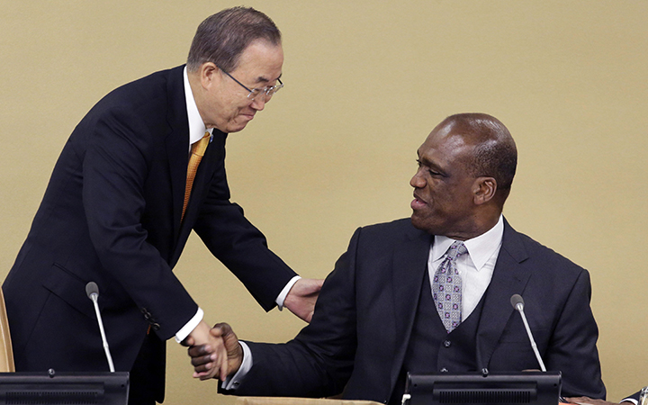 United Nations Secretary-General Ban Ki-moon, left, shakes hands with Ambassador John Ashe, of Antigua and Barbuda, the President of the General Assembly 68th session, at United Nations headquarters on Sept. 17, 2013. 