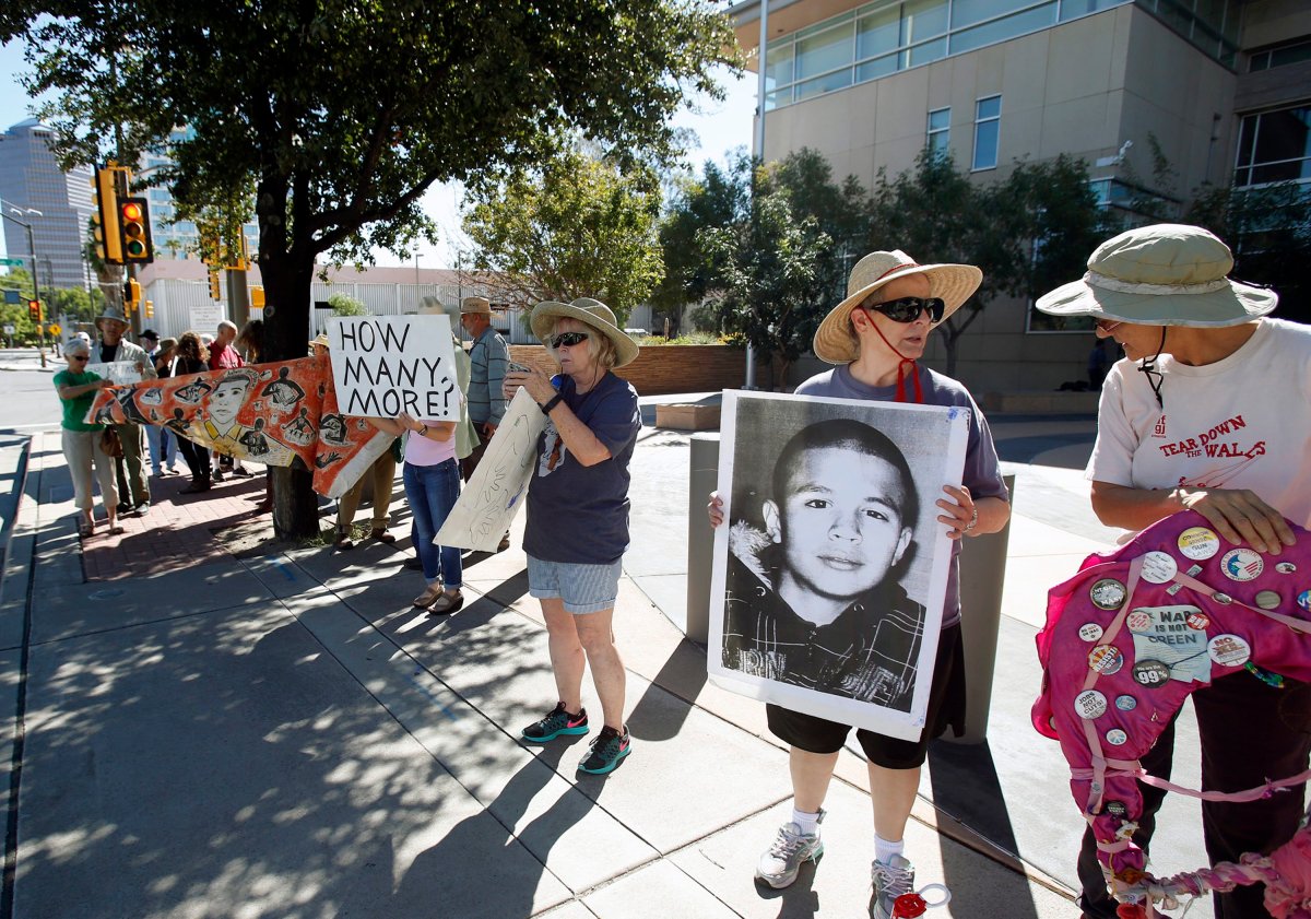Supporters from a number of humanitarian groups gather at a vigil for border shooting victim José Antonio Elena Rodríguez in front of the federal courthouse in Tucson, Ariz on Friday, Oct. 9, 2015. 