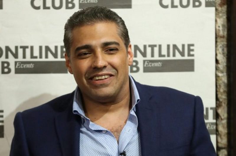 Former Al Jazeera bureau chief Mohamed Fahmy smiles during a talk at the Frontline Club in London, Wednesday Oct. 7, 2015.