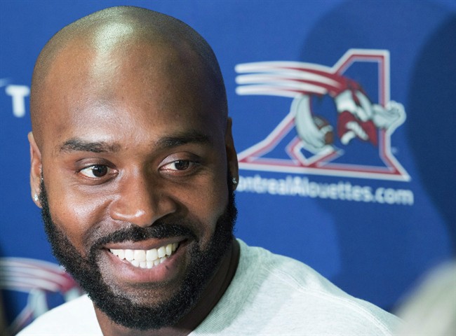 Then-Montreal Alouettes quarterback Kevin Glenn smiles as he speaks during a news conference in Montreal, Wednesday, October 14, 2015. 