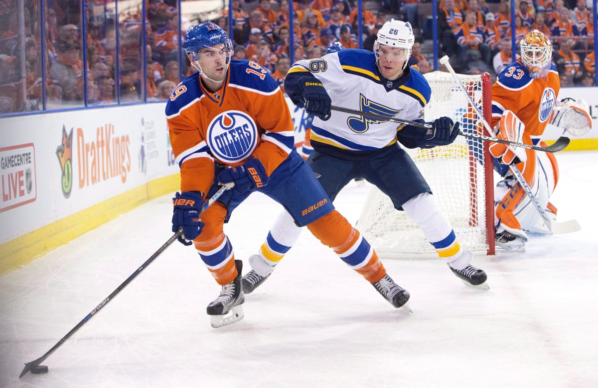 St. Louis Blues' Paul Stastny (26) chases Edmonton Oilers' Justin Schultz (19) during first period NHL action in Edmonton, Alta., on Thursday October 15, 2015.