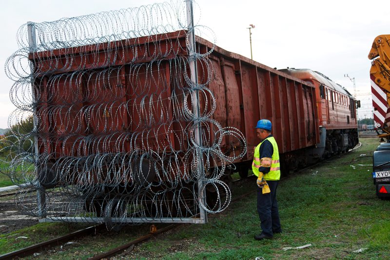 Razor wire is carried on a train wagon to be used as border closure between Hungary and Croatia, at the railway station in Zakany, 230 kms southwest of Budapest, Hungary, Friday, Oct. 16, 2015.