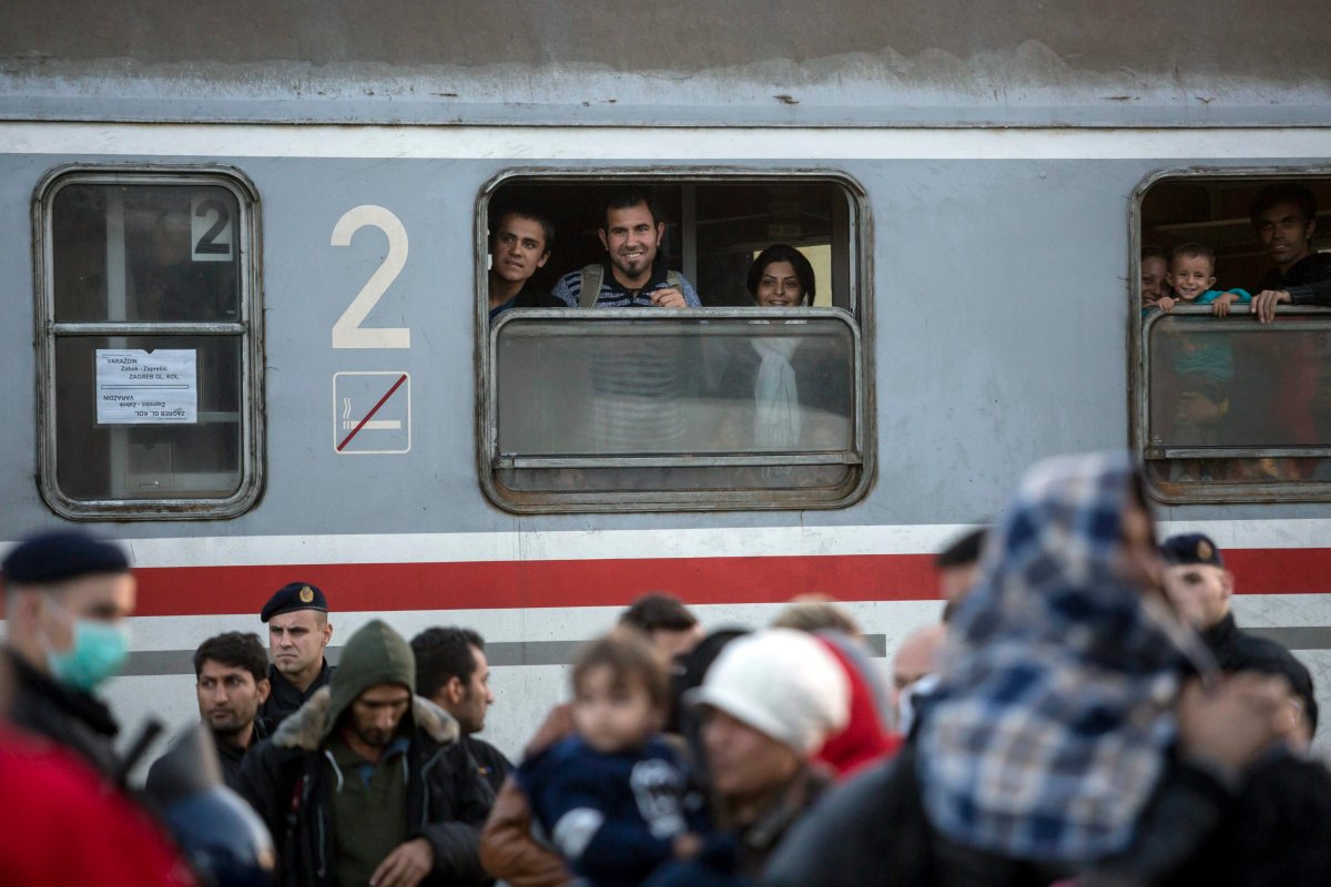Migrants look out of windows of a train at the railway station in Cakovec, Croatia, 17 October 2015, near the border with Slovenia.