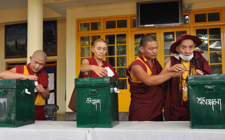 Tibetans living-in-exile cast their vote for the 16th Tibetan Parliamentary election at a polling station in Dharamsala, India, 18 October 2015.