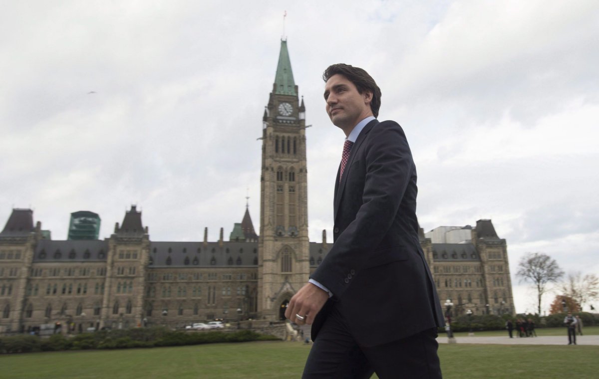 Prime minister designate Justin Trudeau walks to a news conference from Parliament Hill in Ottawa on Oct. 20, 2015.