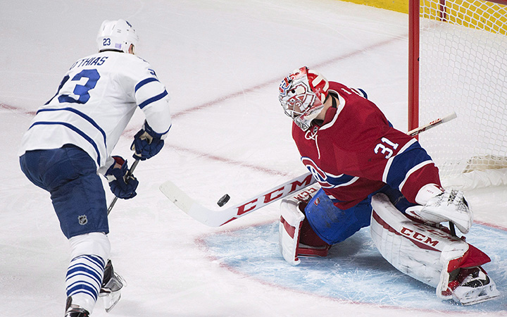 Montreal Canadiens goaltender Carey Price makes a save against Toronto Maple Leafs' Shawn Matthias during first period NHL hockey action in Montreal, Saturday, October 24, 2015. 