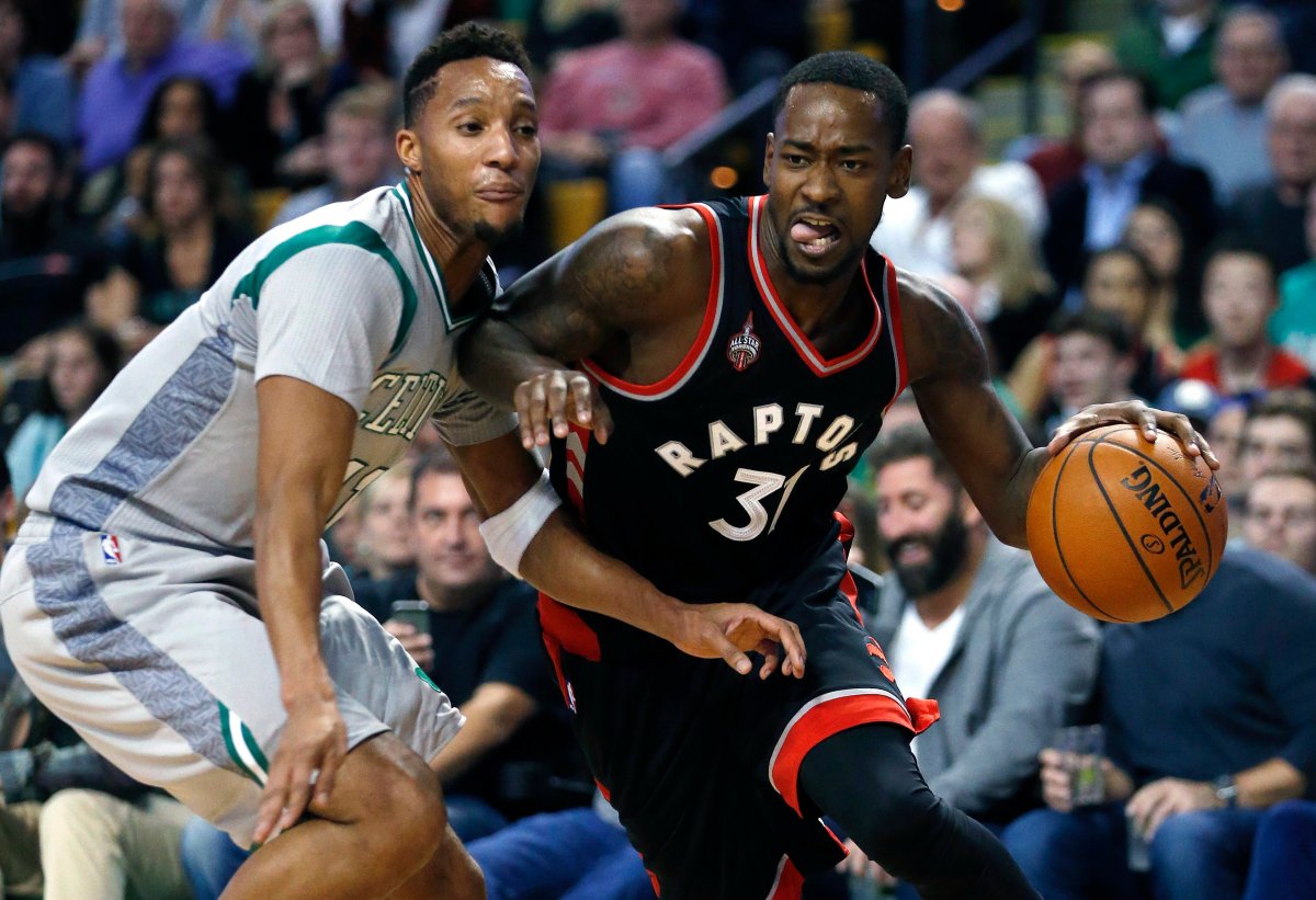 Toronto Raptors' Terrence Ross drives past Boston Celtics' Evan Turner during the fourth quarter of an NBA basketball game in Boston, Friday, Oct. 30, 2015. The Raptors won 113-103.